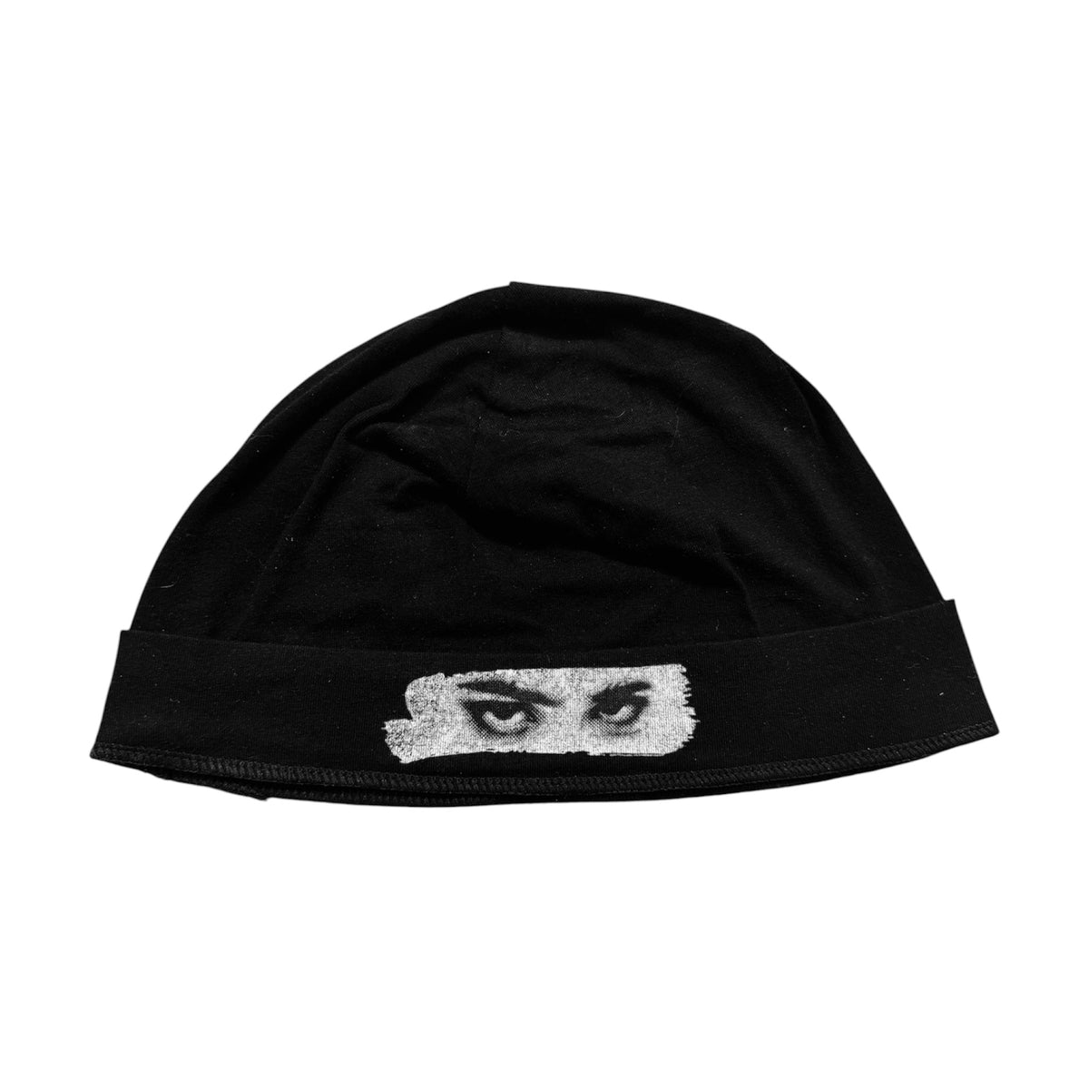 ReFresh Studio black skull cap with a white graphic eye print on the front, made from lightweight moisture-wicking fabric